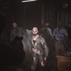 Zombies approach the player character.